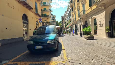 car and pedestrians on a sunny street