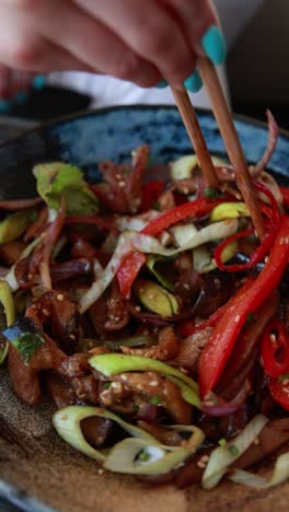 woman eating a stir-fry