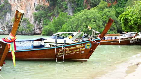 boats anchored on a scenic thai beach