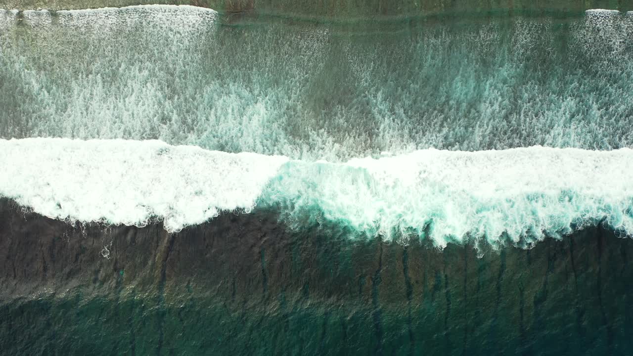 Rough sea waves, dark green stormy ocean background. Aerial slow motion