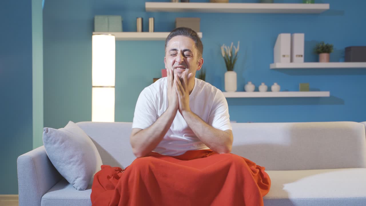 Man lying in bed depressed.