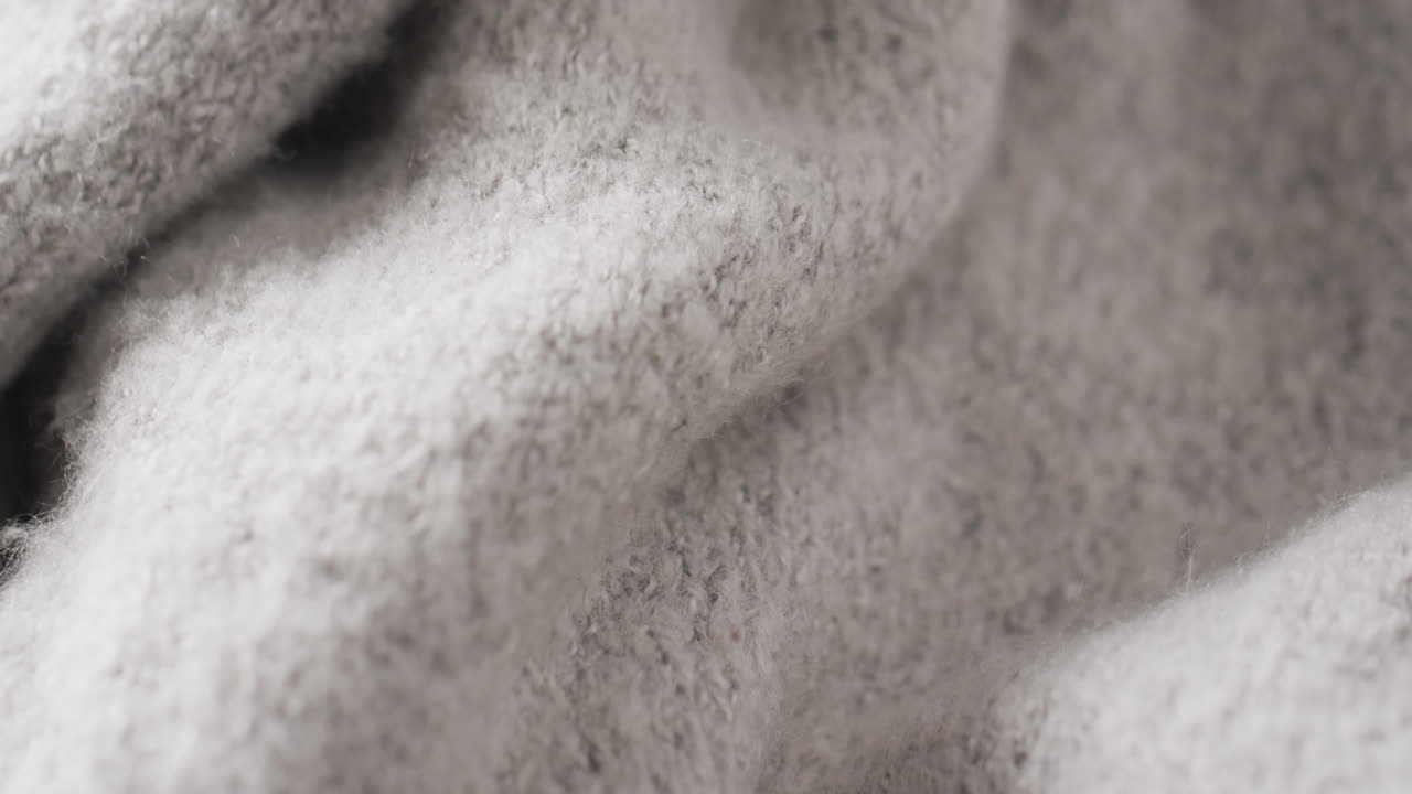 복사 공간과 함께 회색 양털 직물의 클로즈업의 마이크로 비디오