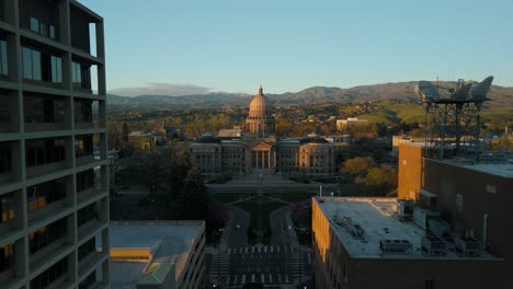 flying toward the idaho state capitol during sunset.