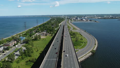 a steady flow of light traffic moves across the elevated burlington skyway, hamilton, ontario, canada