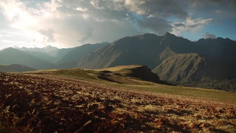 Sunrise-lighting-up-the-beautiful-sacred-valley-below-the-Andes-in-Chincheros,-cusco-as-the-clouds-move