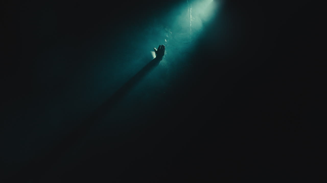 The witch makes a beckoning gesture with her hand