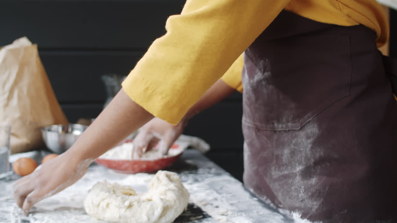 African American Woman Kneading Dough