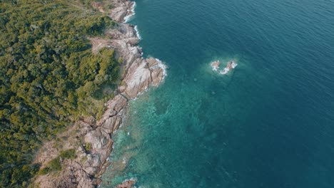 Aerial-Shot-Of-Tropical-Island-with-Crystal-Clear-Sea