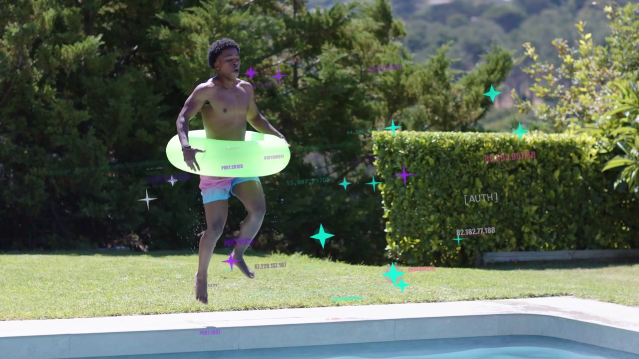 Man carrying neon-green swim ring walking lawn, hopping edge, launching into pool for recreation