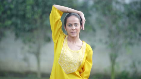 indian girl doing neck stretch yoga exercise