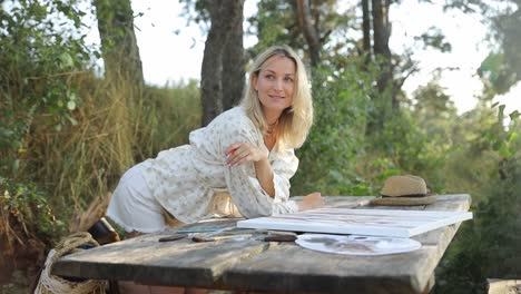 the artist enjoys a carefree and peaceful moment when he paints outdoors in the beautiful - an artist is enjoying a serene and peaceful moment while painting outdoors, beautifully surrounded by nature