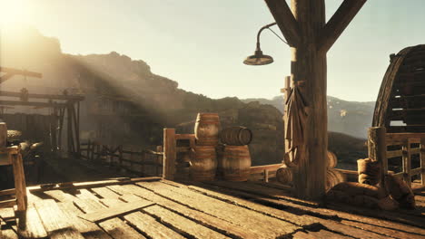 a rustic wooden structure with barrels and a view of a canyon.