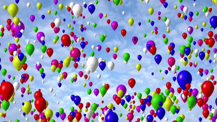 Multicolored balloons flying in the blue sky