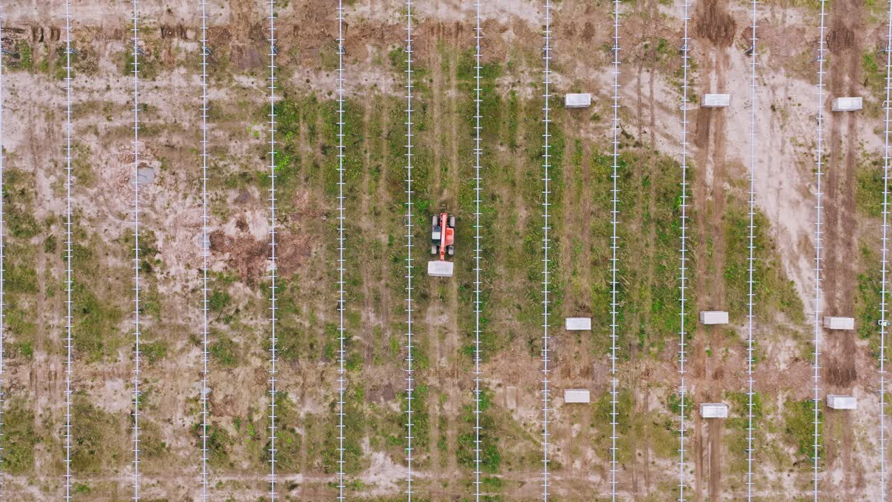 Overhead drone of solar park construction field Europe biodiversity loss concept
