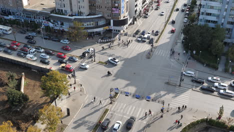 high angle shot of busy traffic at road intersection on sunny day