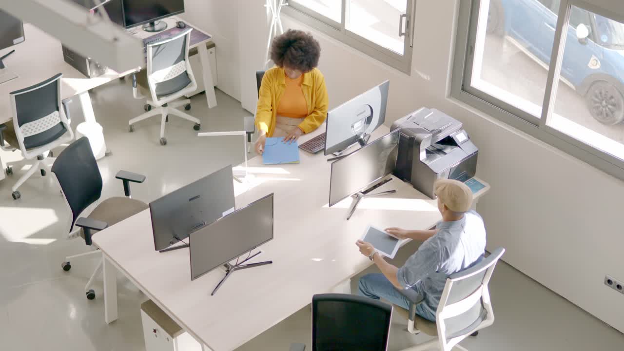 Diverse people arriving at a coworking office in the morning