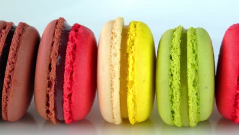 row of multicolored macaroons isolated