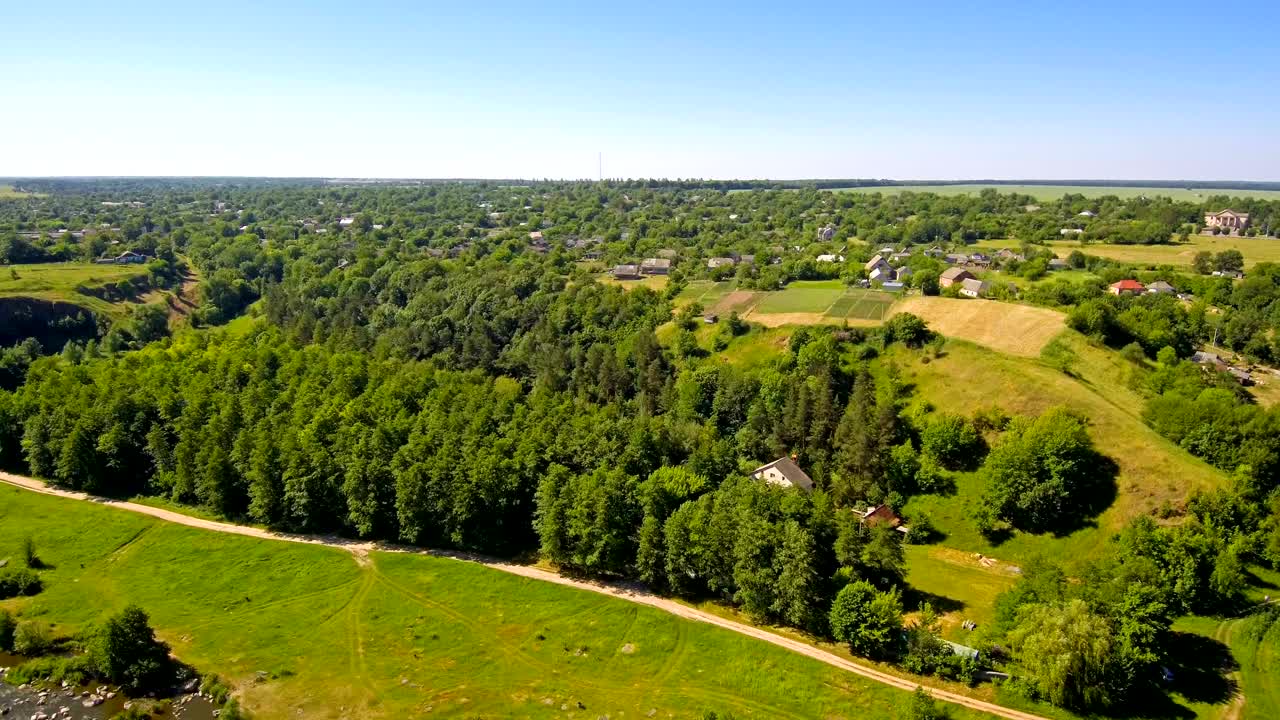 drone watches a bird flying over the village