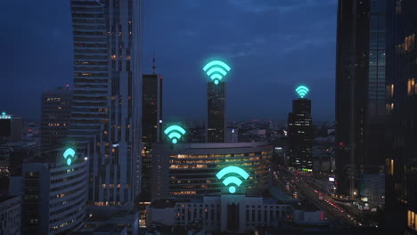 Evening-aerial-footage-of-modern-city-borough-with-high-rise-buildings.-Computer-added-Wifi-symbols-glowing-above-buildings.-Warsaw,-Poland