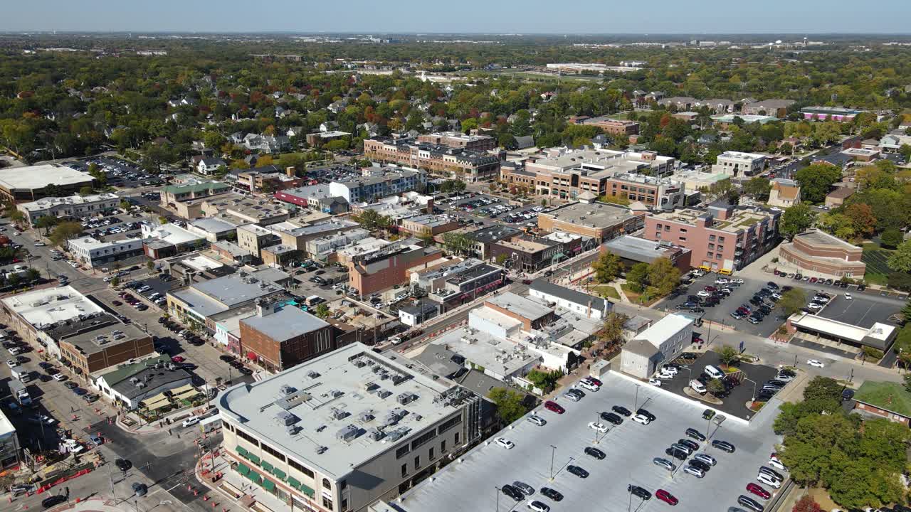 Naperville, IL, a Chicago suburb, on a sunny fall day, featuring buildings, streets. Orbit Left Day NW