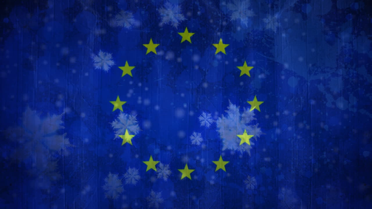 Bandiera europea con fiocchi di neve durante una nevicata