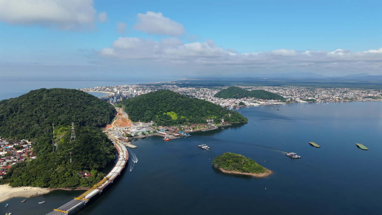 Panorama aerial view of coastal and remote settlement after the new Guaratuba-Matinhos Bridge project in forested site, Paraná, Brazil