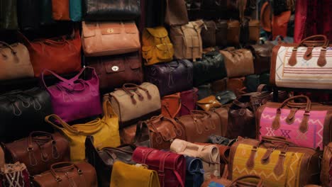 colorful leather bags displayed in a market