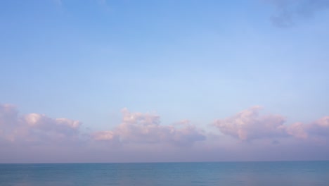 abstract colorful landscape background. panoramic view of abstract colorful cumulus fluffy clouds moving over ocean green water. sunlight reflects on the surface of the sea. 4k nature background sea