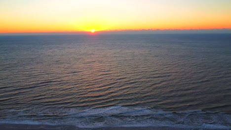 early morning sunrise over the ocean and shore