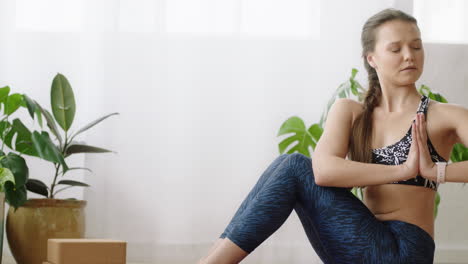 attractive yoga woman practicing meditation enjoying mindfulness exercise at home training on exercise mat