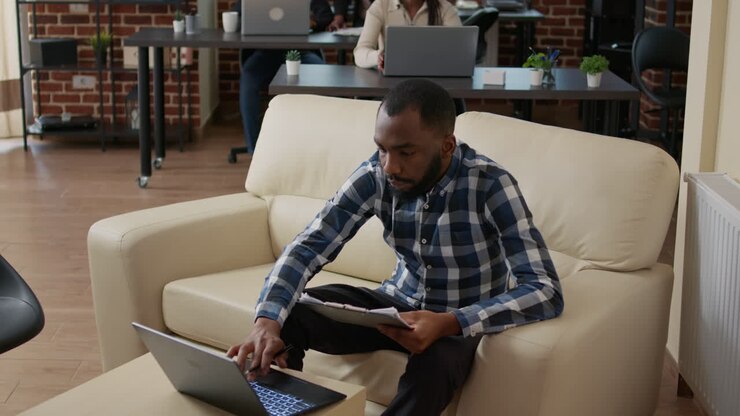 Portrait of businessman analyzing statistics charts on computer