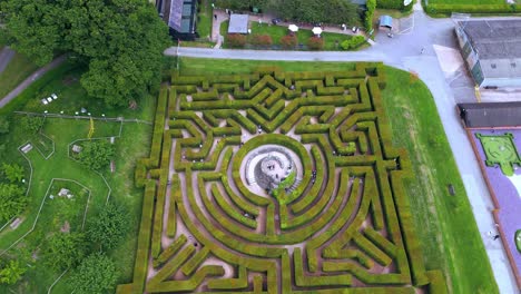 aerial view of a large hedge maze with people