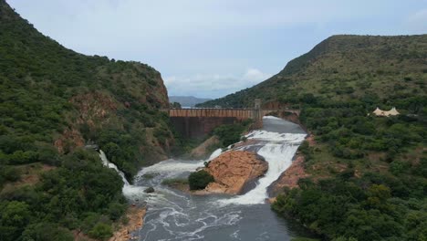 drone shot pushing in on dam wall