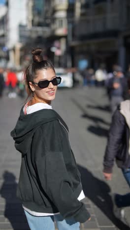 woman walking down a city street