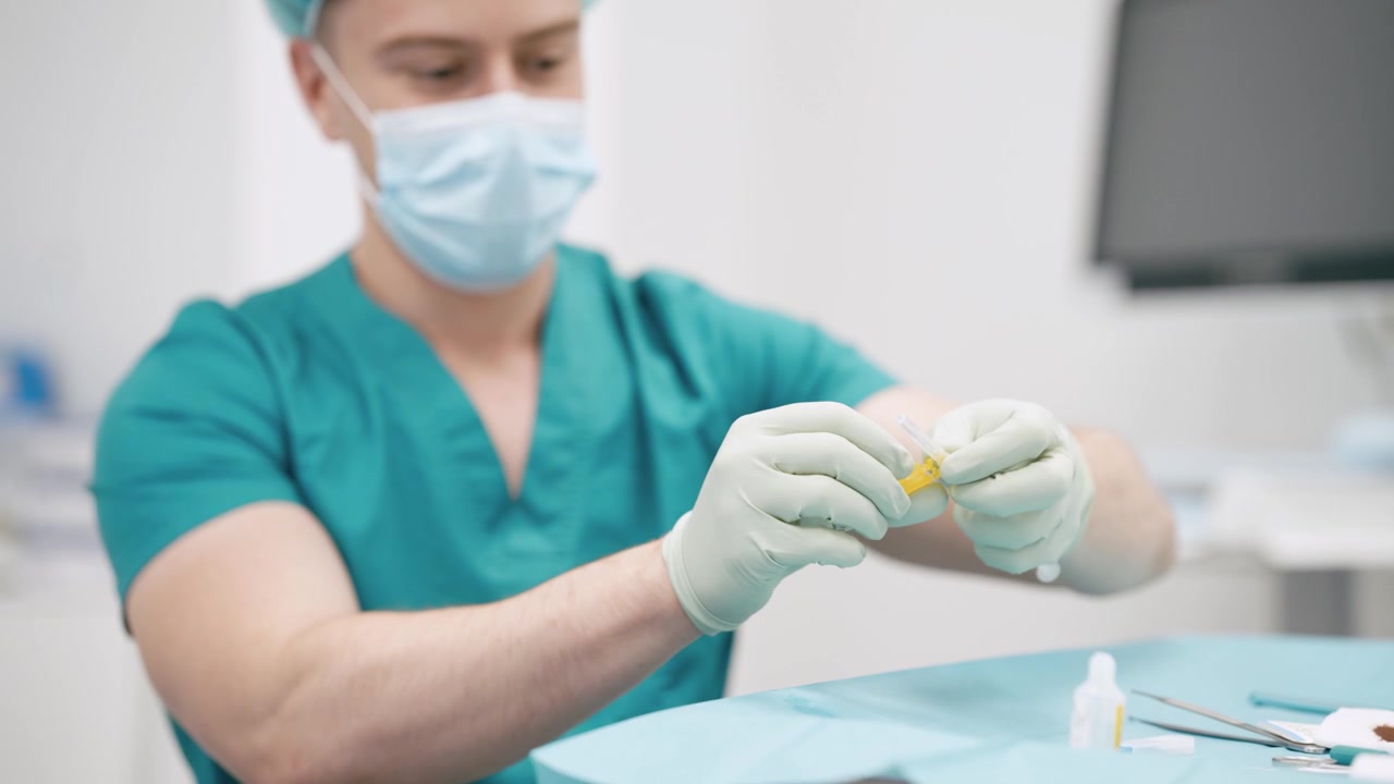 Medical Professional Preparing a Syringe in a Clinical Setting