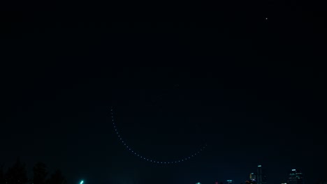 A dynamic jumping tiger face is formed by illuminated flying drones in a circle above Ttukseom Hangang River Park, Gwangjin-gu, Seoul at night