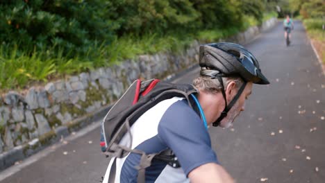 male cyclist cycling on the road