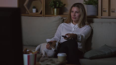 businesswoman watching tv in living room