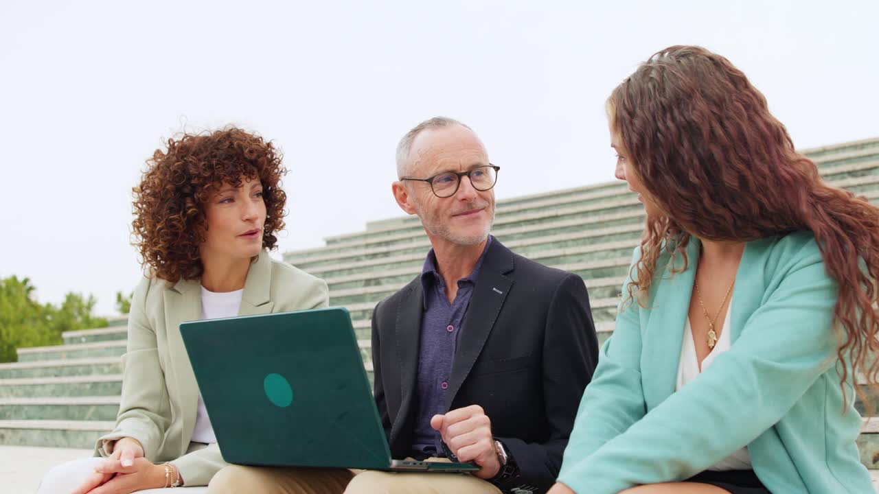 Business people working together outdoors