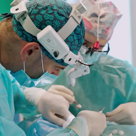 group of surgeons at work in operation theater