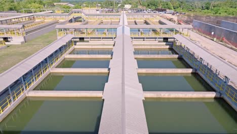 aerial forward over salt water basin, industrial plant for desalination