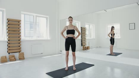 woman practicing yoga in a studio