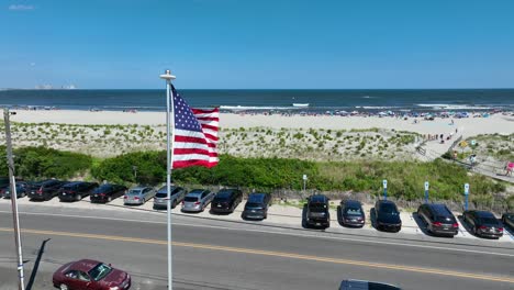 american flag waving at east coast beach in united states of america