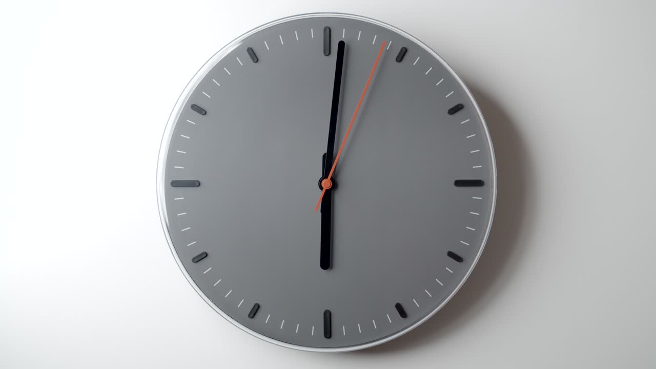 Clock Face in Time lapse from 6 to 8 hours o'clock on white wall