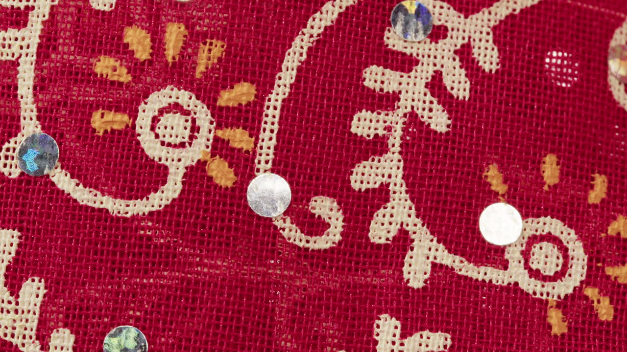 Close-up of red fabric with floral pattern