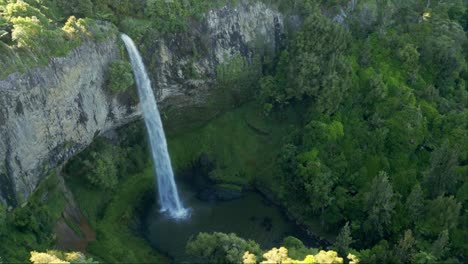 A-drone-shot-of-a-waterfall-in-Raglan-New-Zealand-called-bridal-falls