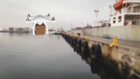 drone carrying a package over a port