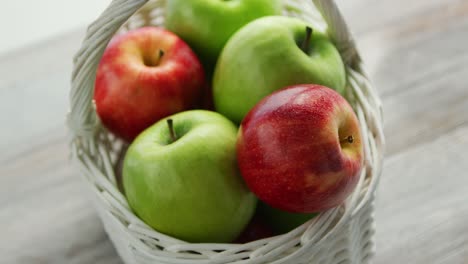 mixed green and red apples in basket