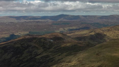 wide angle shot of the vast scottish mountain valleys from the ben vorlich summit