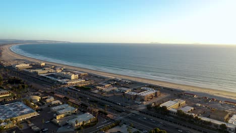 aerial drone in 4k over silver strand beach in coronado during golden hour towards pacific ocean - san diego california 2022